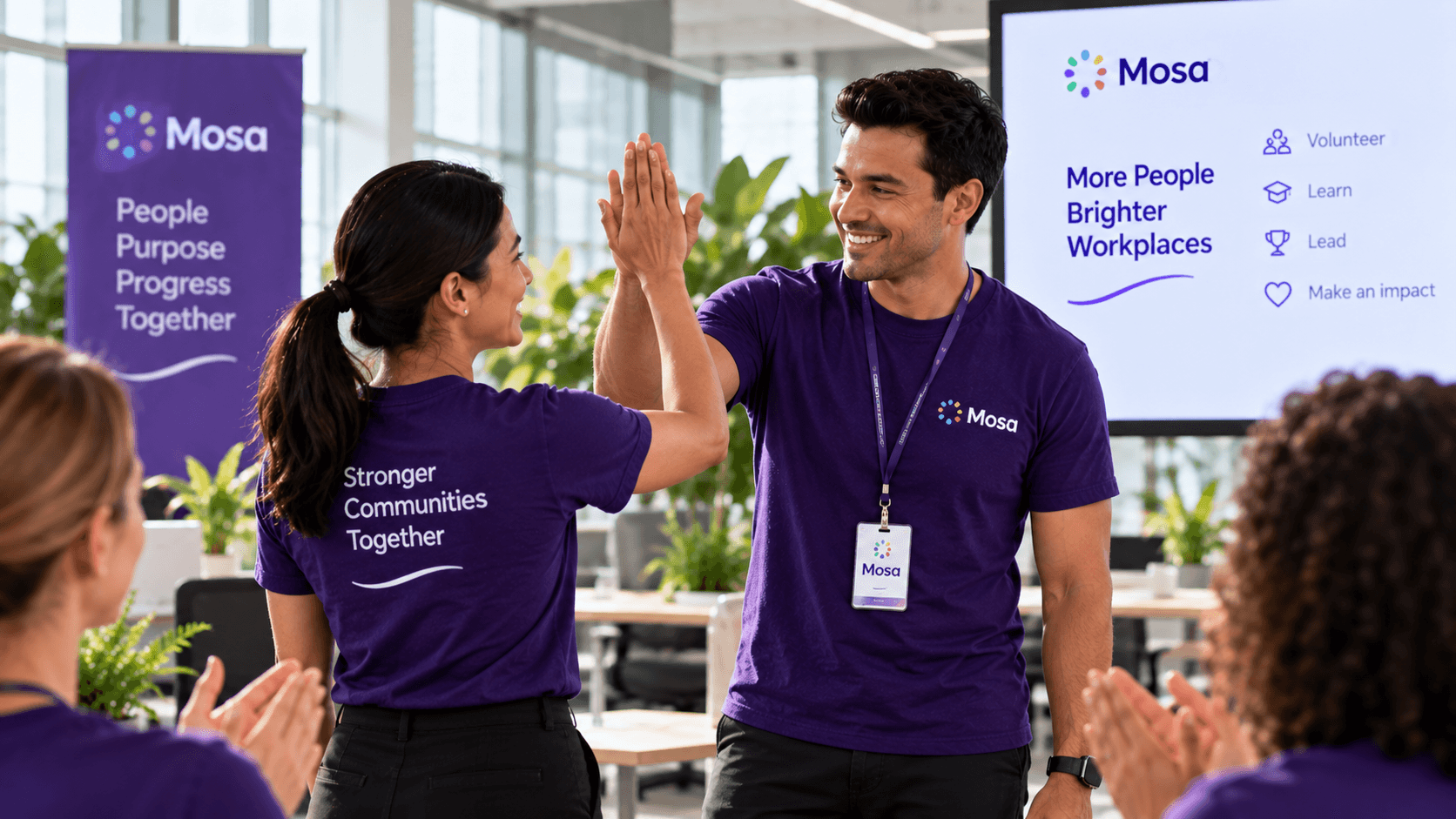 Workplace leaders celebrating with their colleagues.